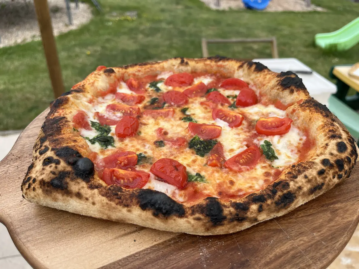 Margherita pizza on a wooden board